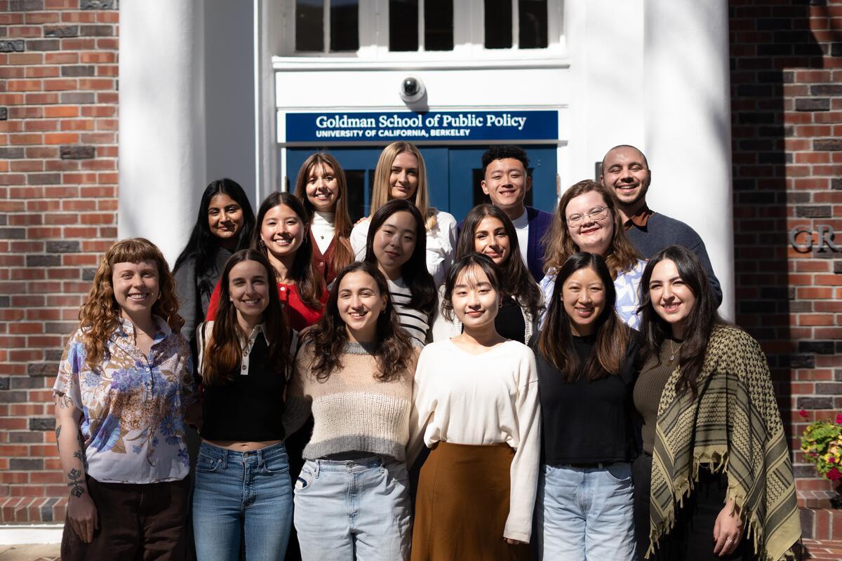 Photo of a group of students on the steps of a building.